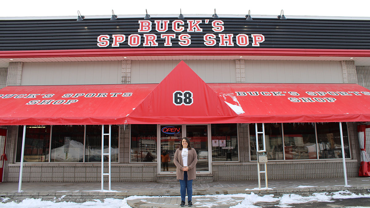Owner of Buck's Sports Shop, Amanda Buckshot in front of her store