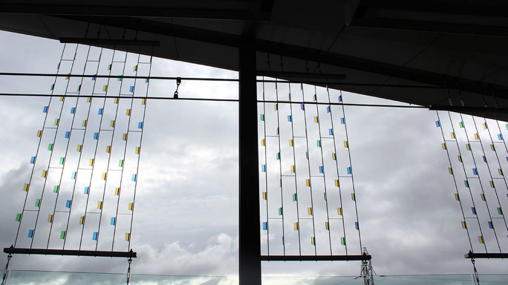 At Blair station, thin coloured glass is strung up vertically and meant to sway in the wind.