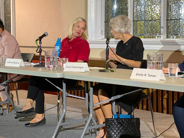 Carol Clemenhagen speaks as Catherine McKenna is shown listening.