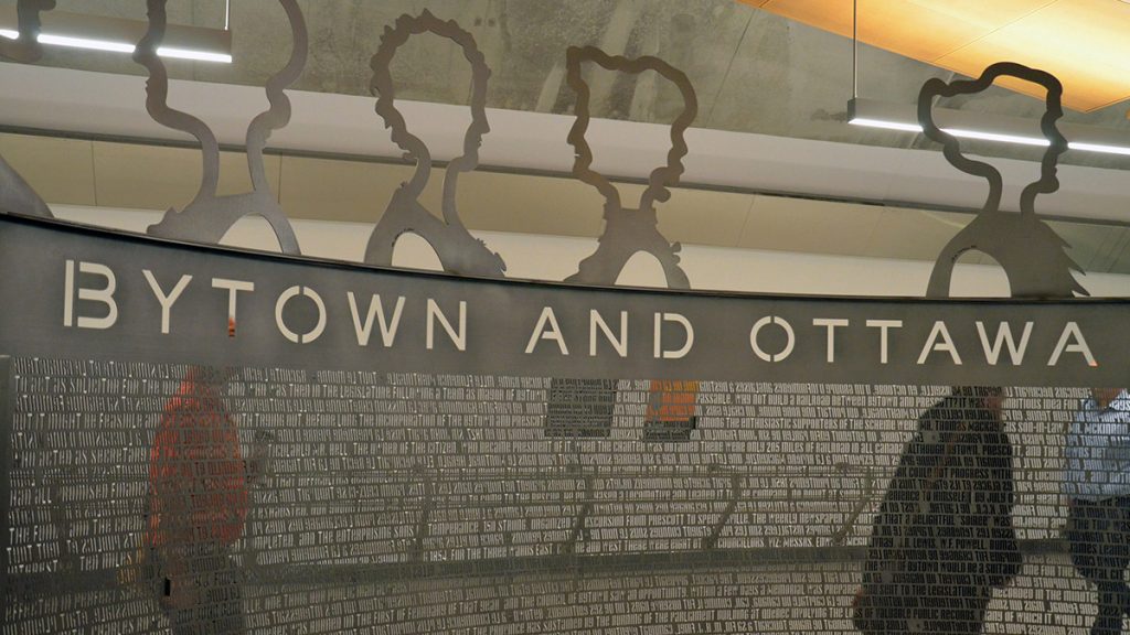 The metal structure in the middle of Lyon station depicts the 32 women who founded the Ottawa chapter of the Women's Canadian Historical Society in 1898.