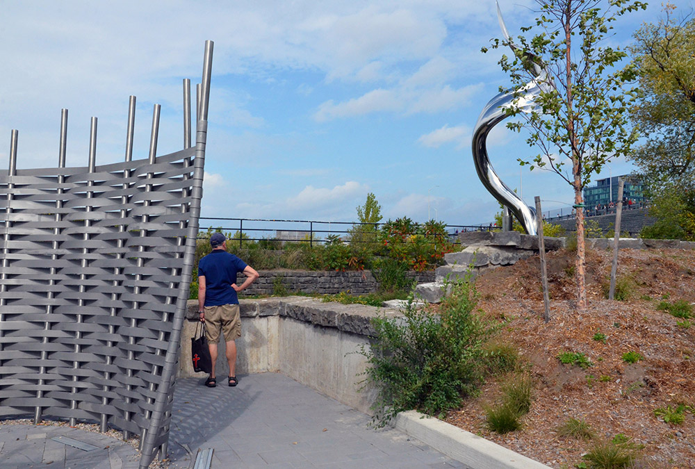 A chrome eel and a split-ash woven basket lie behind Pimisi station.