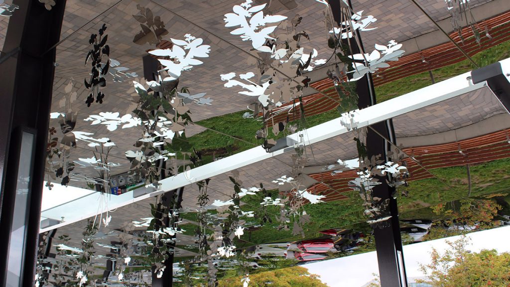 Jyhling Lee's reflective National Garden hangs from the ceiling at Tremblay station.