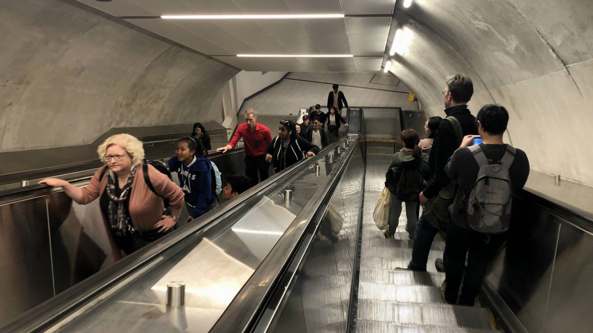 the up and down escalators at the Rideau LRT station