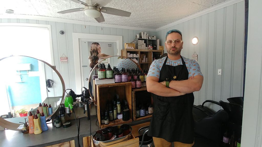 Lucas Nault stands inside the Organic Salon.