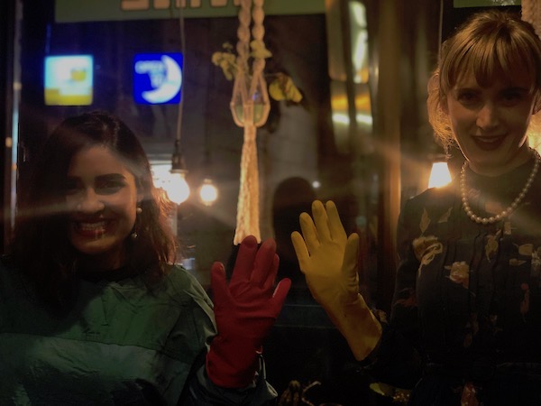 Friends Nadia Khan and Mariel Angus pose in their rubber gloves in anticipation for the film. Third friend, Shannon Munsie, chose not to be photographed.