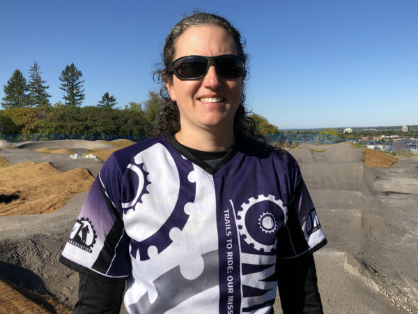 Sandra Beaubien stands in front of the new Carlington Bike Park.