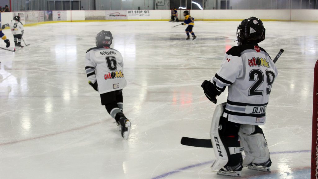 A youth goalie standing tall in net at the Jim Durrell Recreation Centre in Ottawa. 