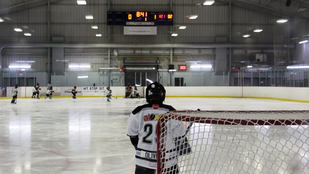 Behind the net view at the  Jim Durrell Recreation Centre in Ottawa. As a pewee boys team compete in a game. 