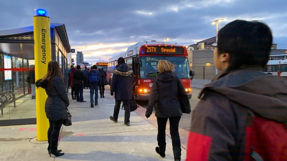 Commuters rushing to connecting bus routes from Tunney's Pasture station.
