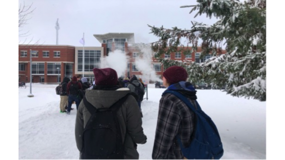 Two students from Sacred Heart Catholic High School, ages 15 and 16, vaping in front of the school.