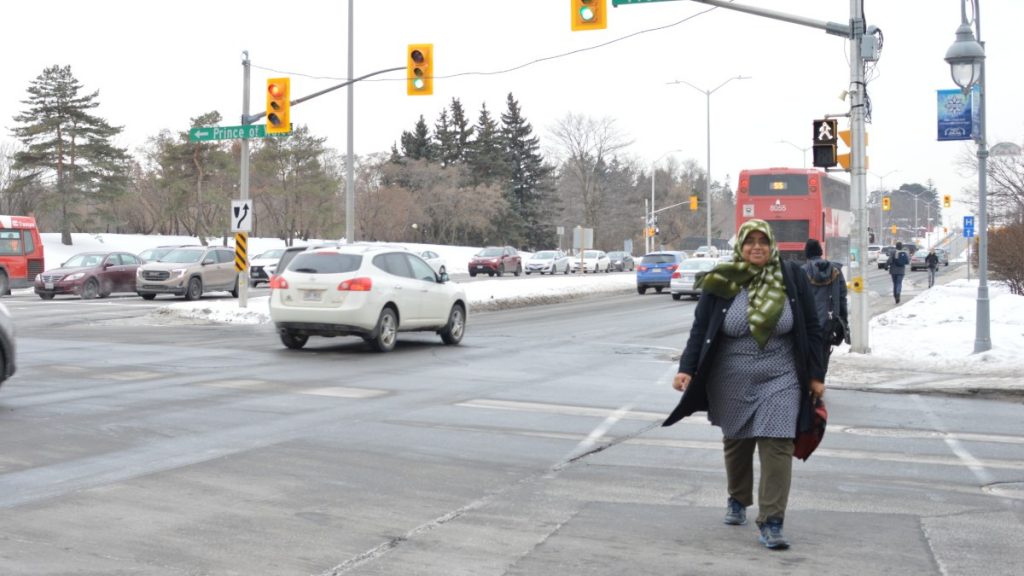 Chelby Daigle crossing the street.