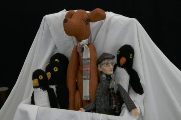 A variety of puppets positioned together.