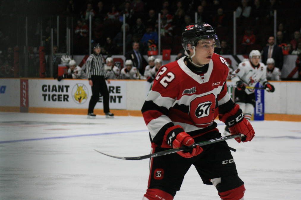 Jack Quinn, a highly touted prospect for the Ottawa 67s, watching the play develop.