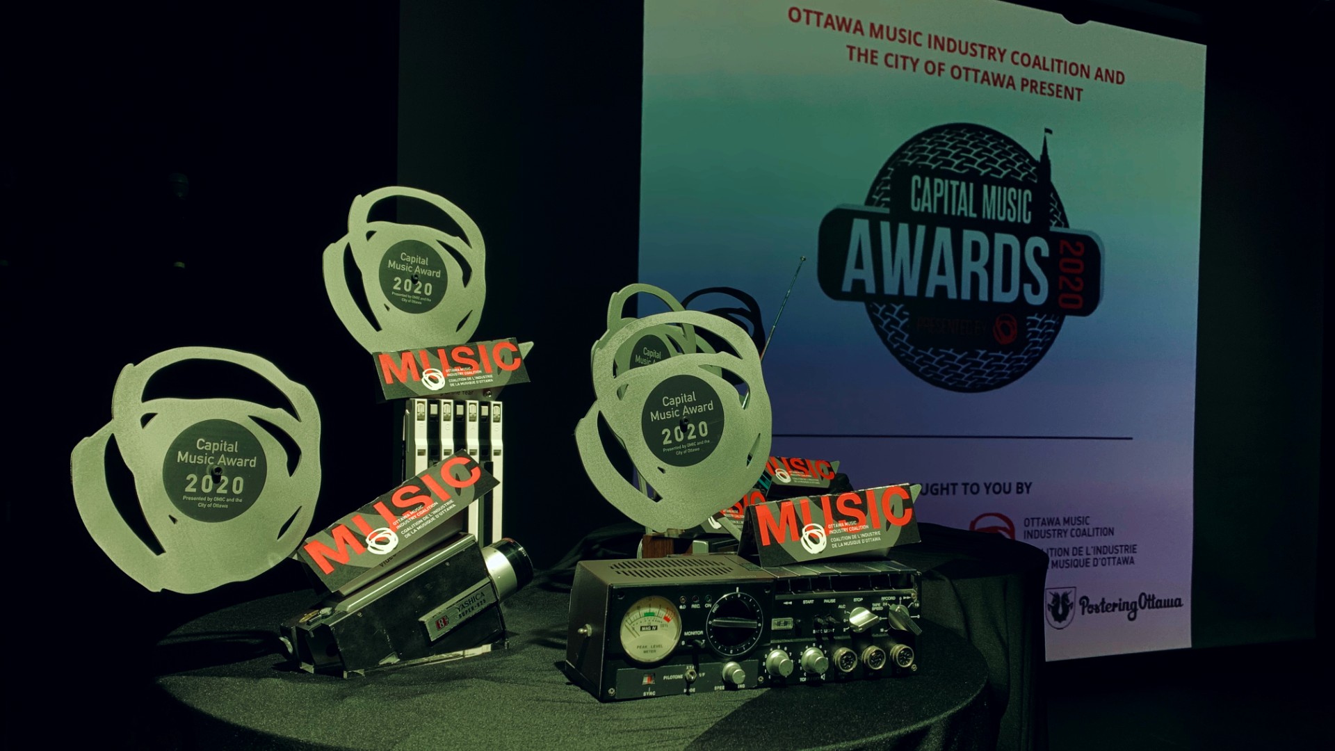 Trophies for the Capital Music Awards line are displayed on stage.