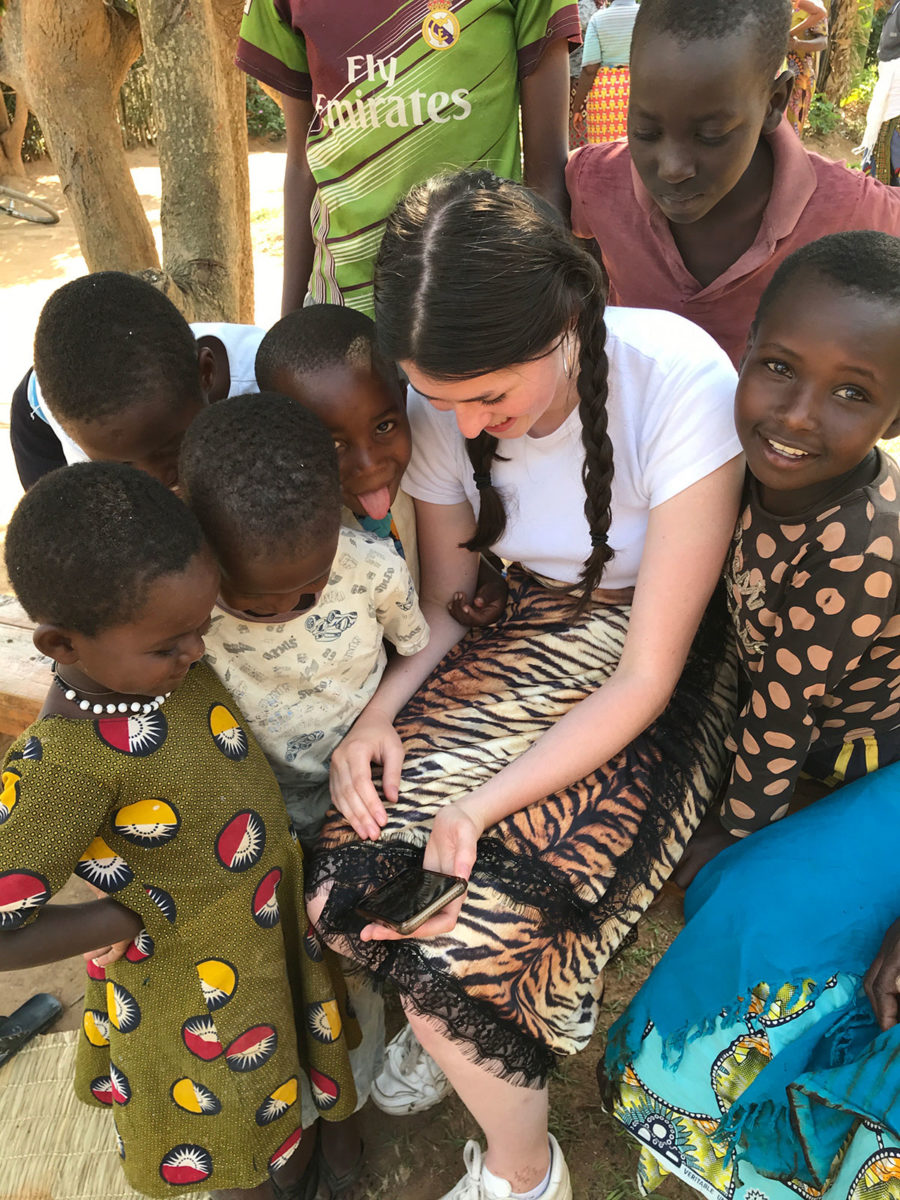 Ella visiting Bugesera reconciliation village in Rwanda. [Photo © Sarah MacFadyen]