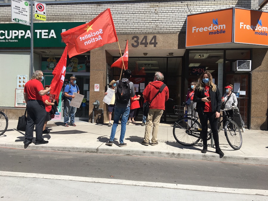 ACORN members rally outside a downtown Toronto office