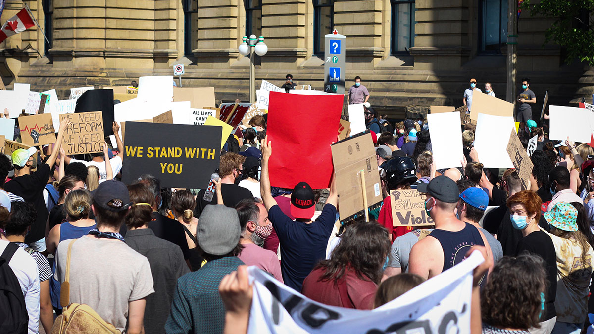 Thousands of protestors march down Wellington Street.