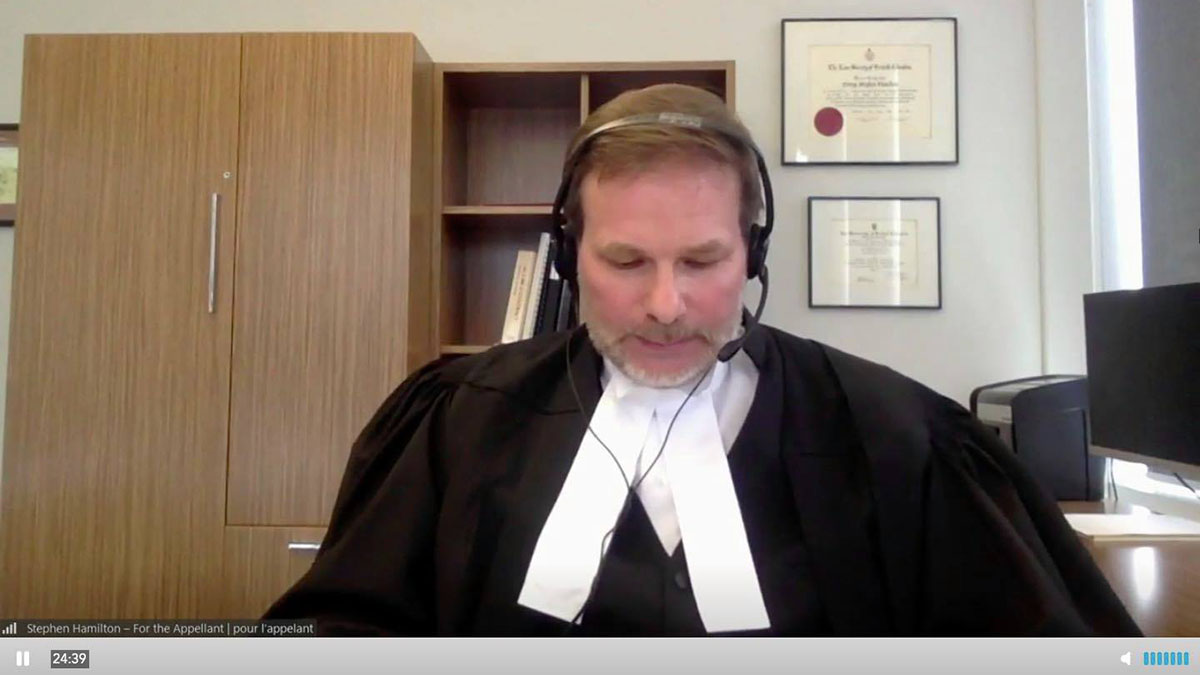 Lawyer Stephen Hamilton appears in front of the camera with his black robe and white bands