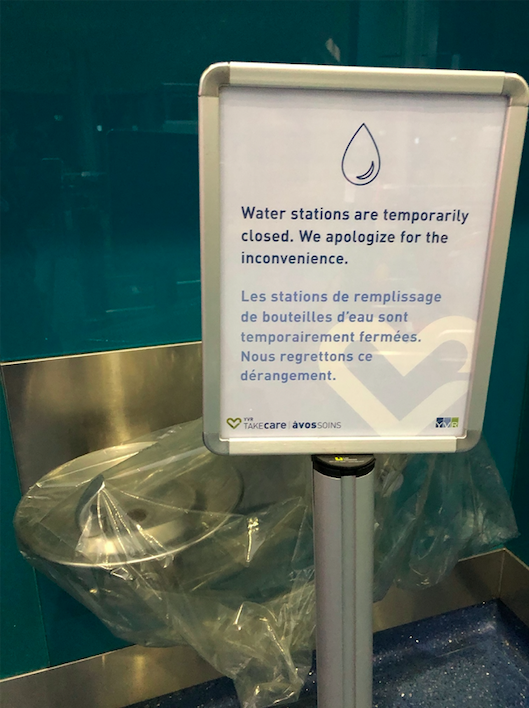 Though washrooms remain open in both the Vancouver and Toronto airports, water stations are closed. (Photo credit © Nalini Raman-Wilms)