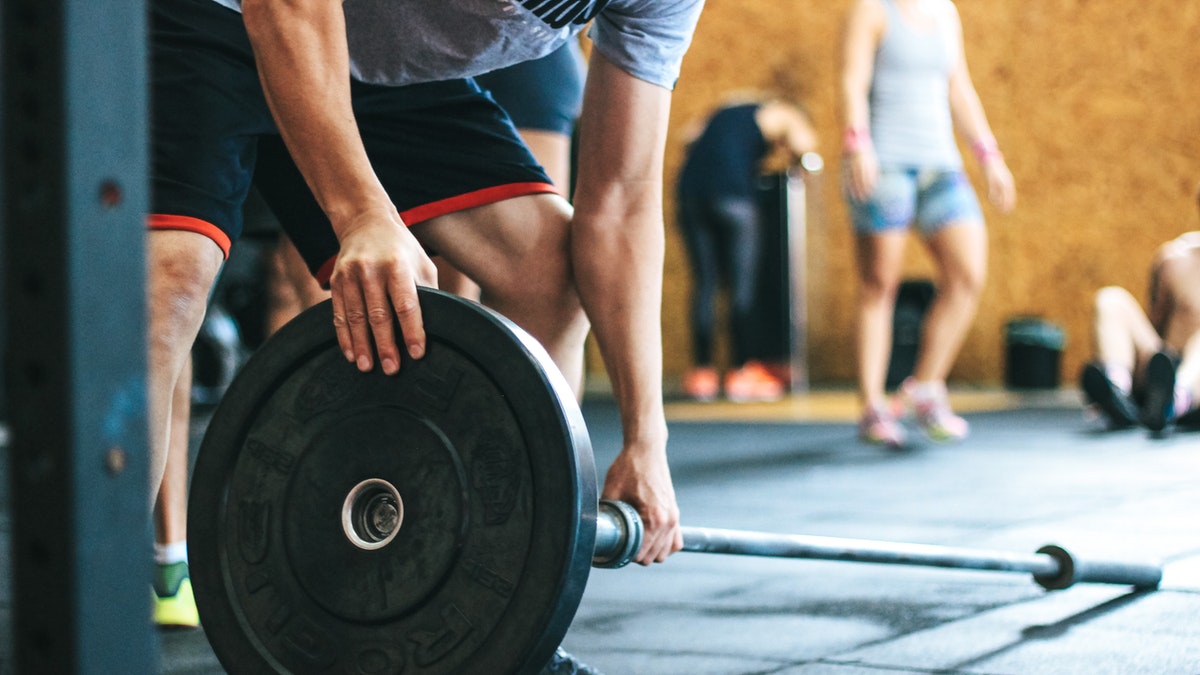 Stock photo of people working out at a gym.