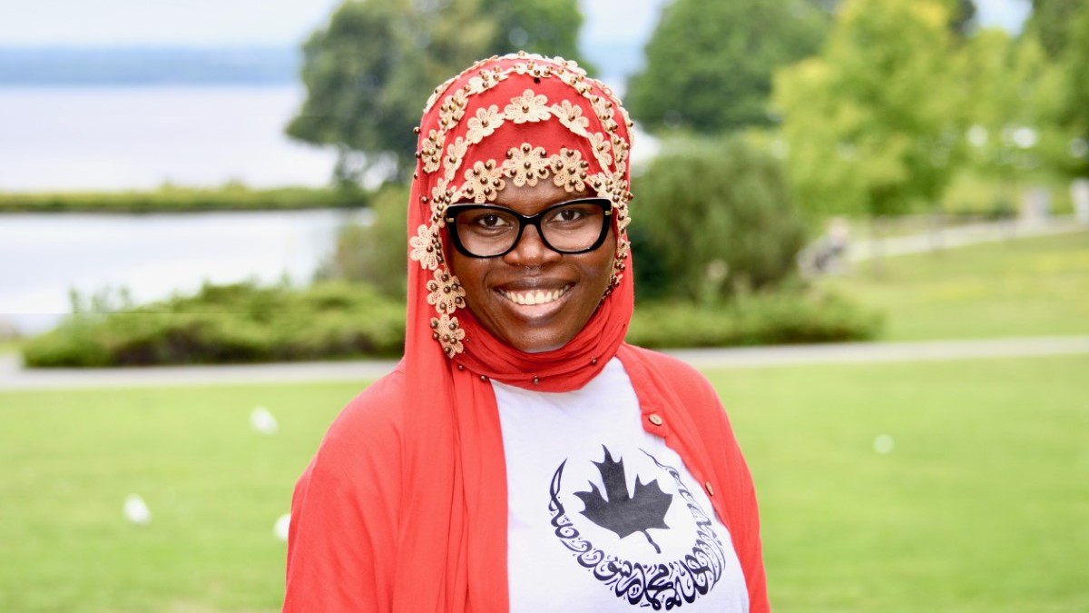 Portrait of Sahada Alolo in Ottawa Muslim Women's Organization shirt