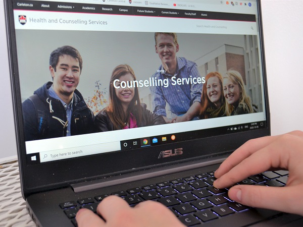 Laptop with Carleton University's counselling services webpage open.