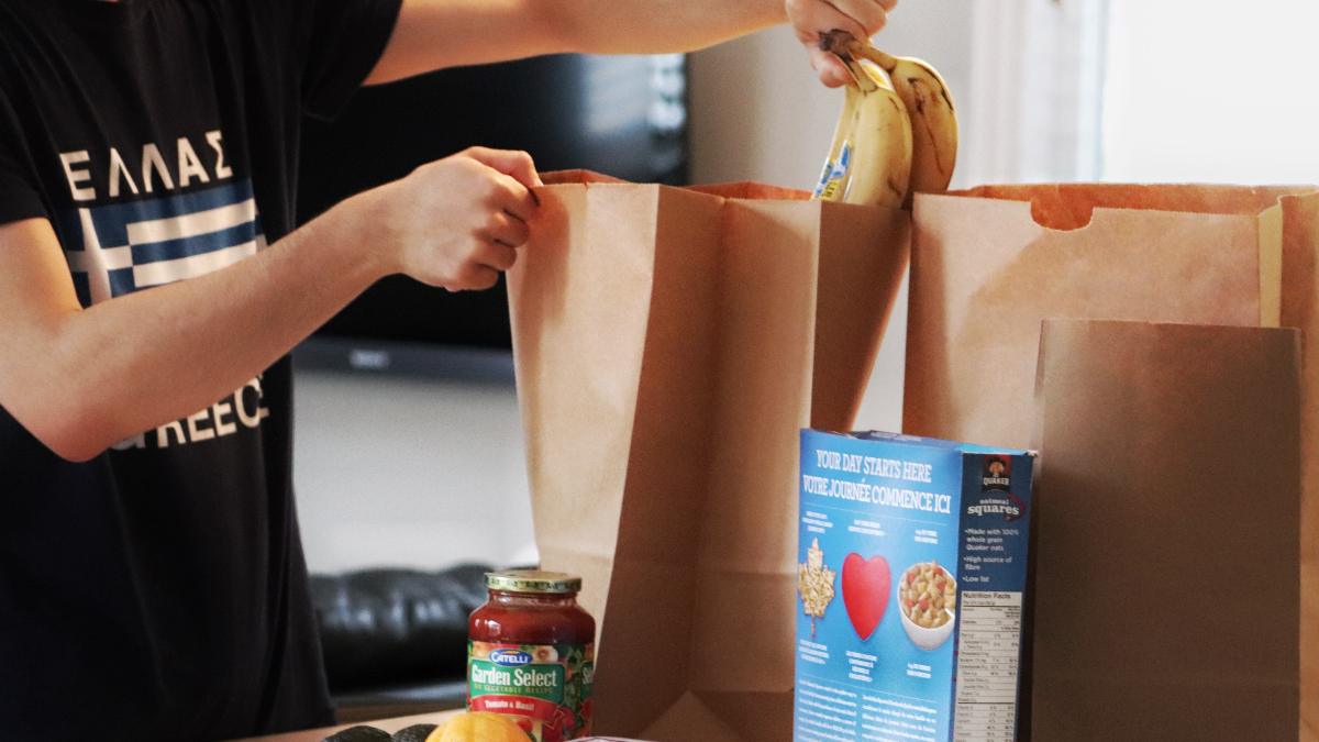 Man packing paper bag