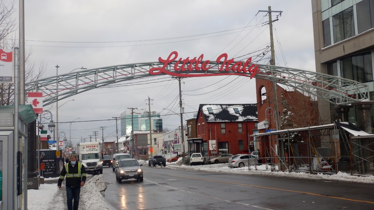 The entrance of Little Italy, marked by an arching sign.