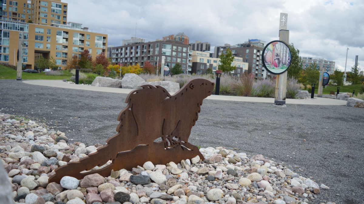 A statue of a beaver stares at Pindigen Park in Ottawa. Located near LeBreton Flats, the park is meant to highlight Indigenous culture and heritage. [Photo © Christianna Alexiou]