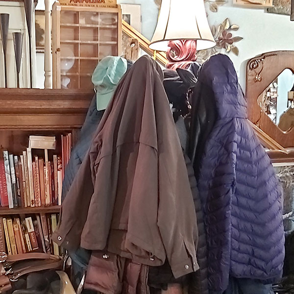 Donated winter jackets on a coatrack in highjinx.