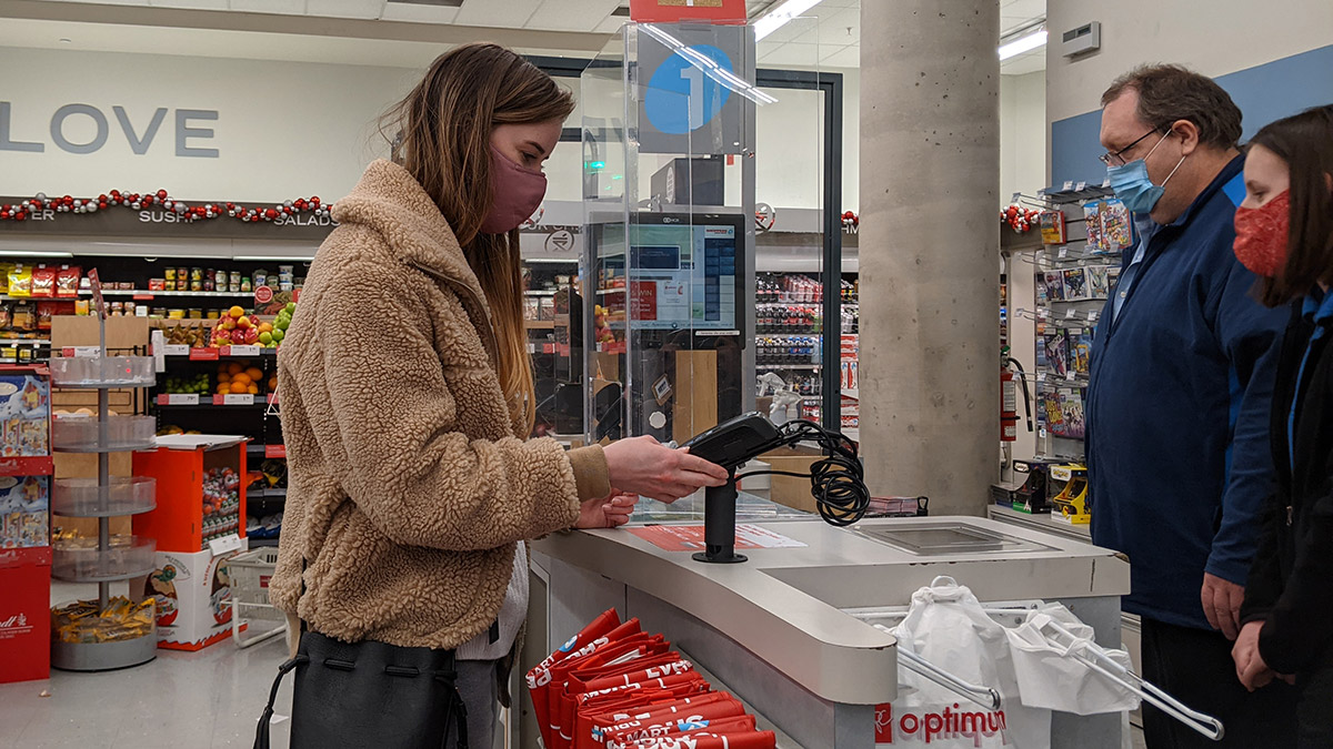 Anne-Marie Côté uses a payment terminal at an Ottawa Shopper's Drug Mart.