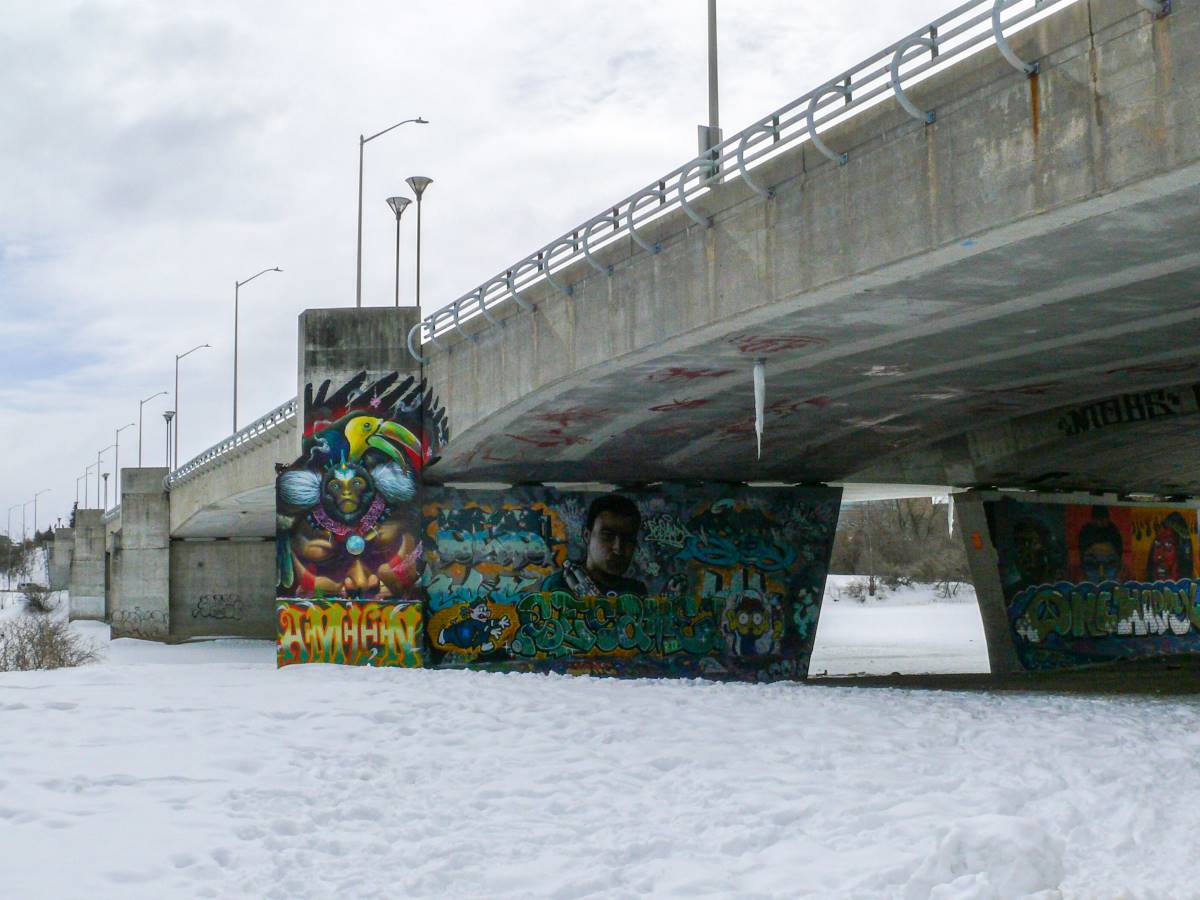 The under carriage of the Dunbar bridge, covered in colourful graffiti