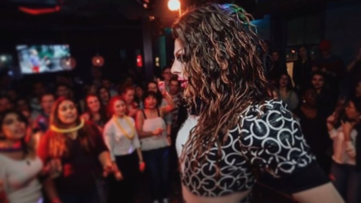 drag queen on stage with crowd