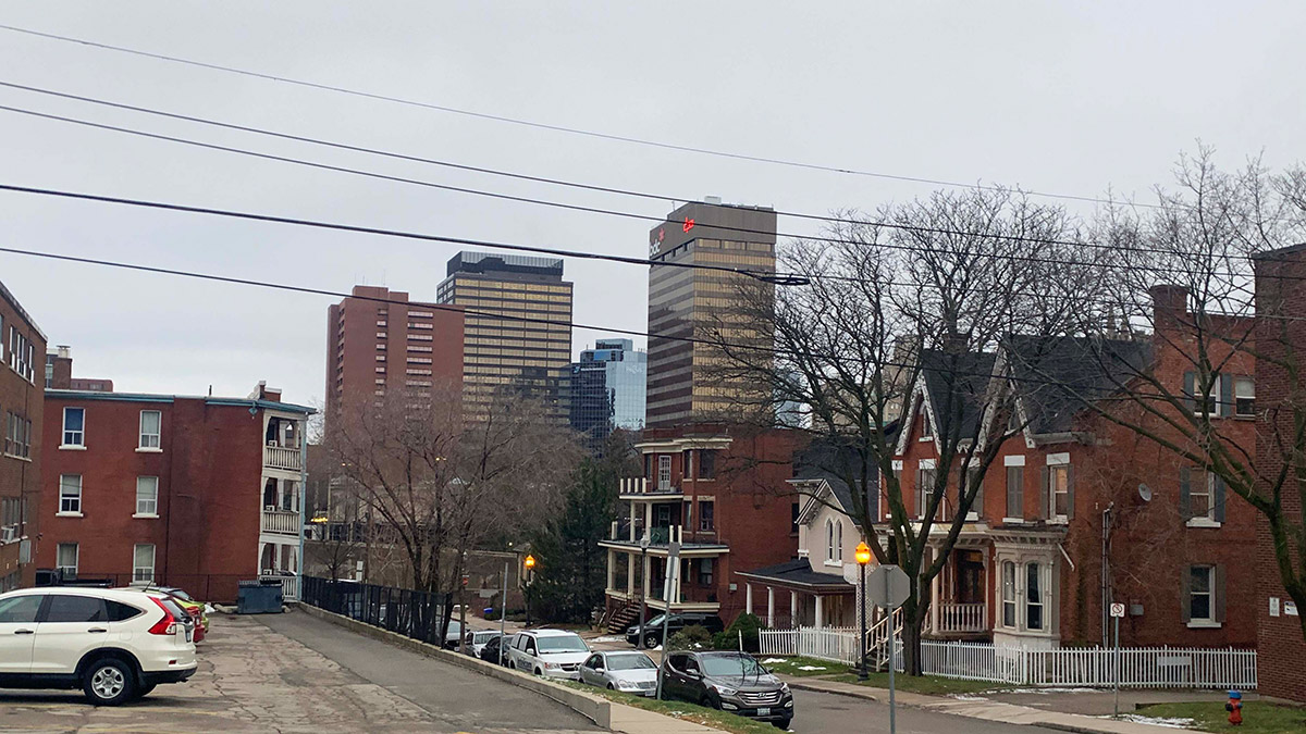 Photo shows houses and apartment buildings in downtown Hamilton