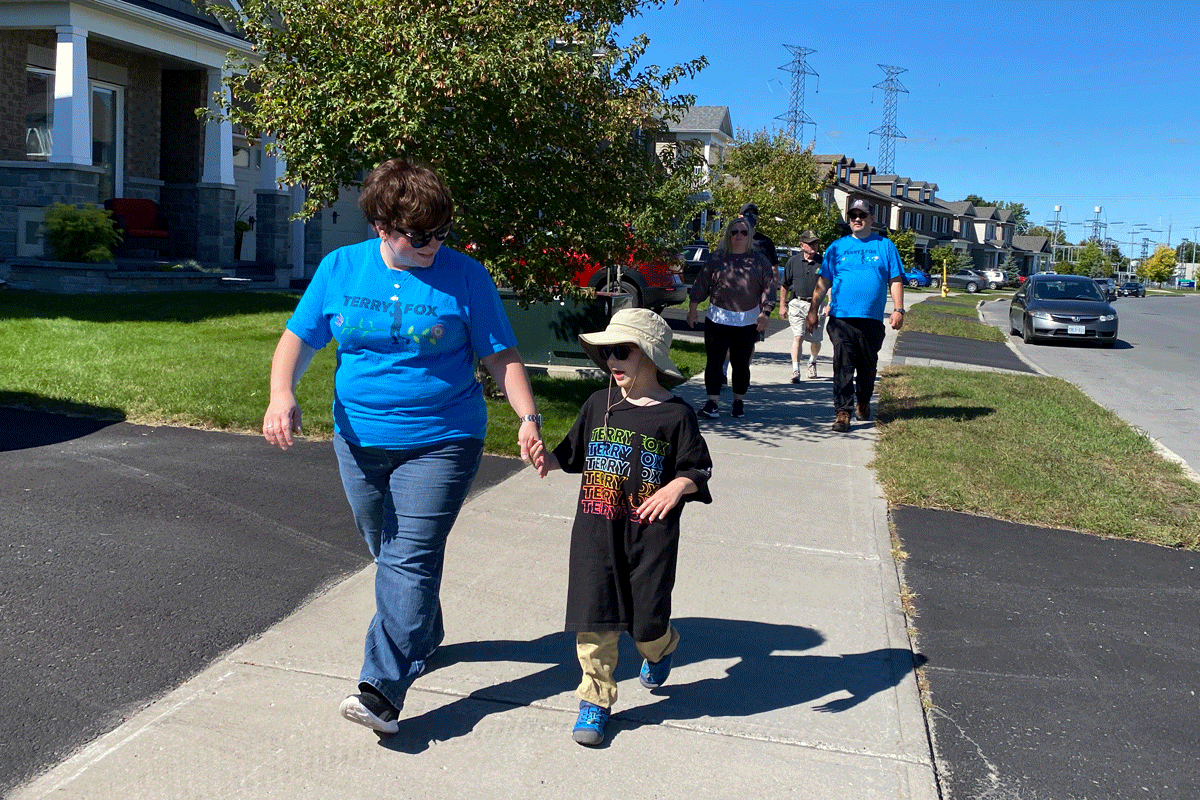 Stephanie Lingard walking with her son Danny.