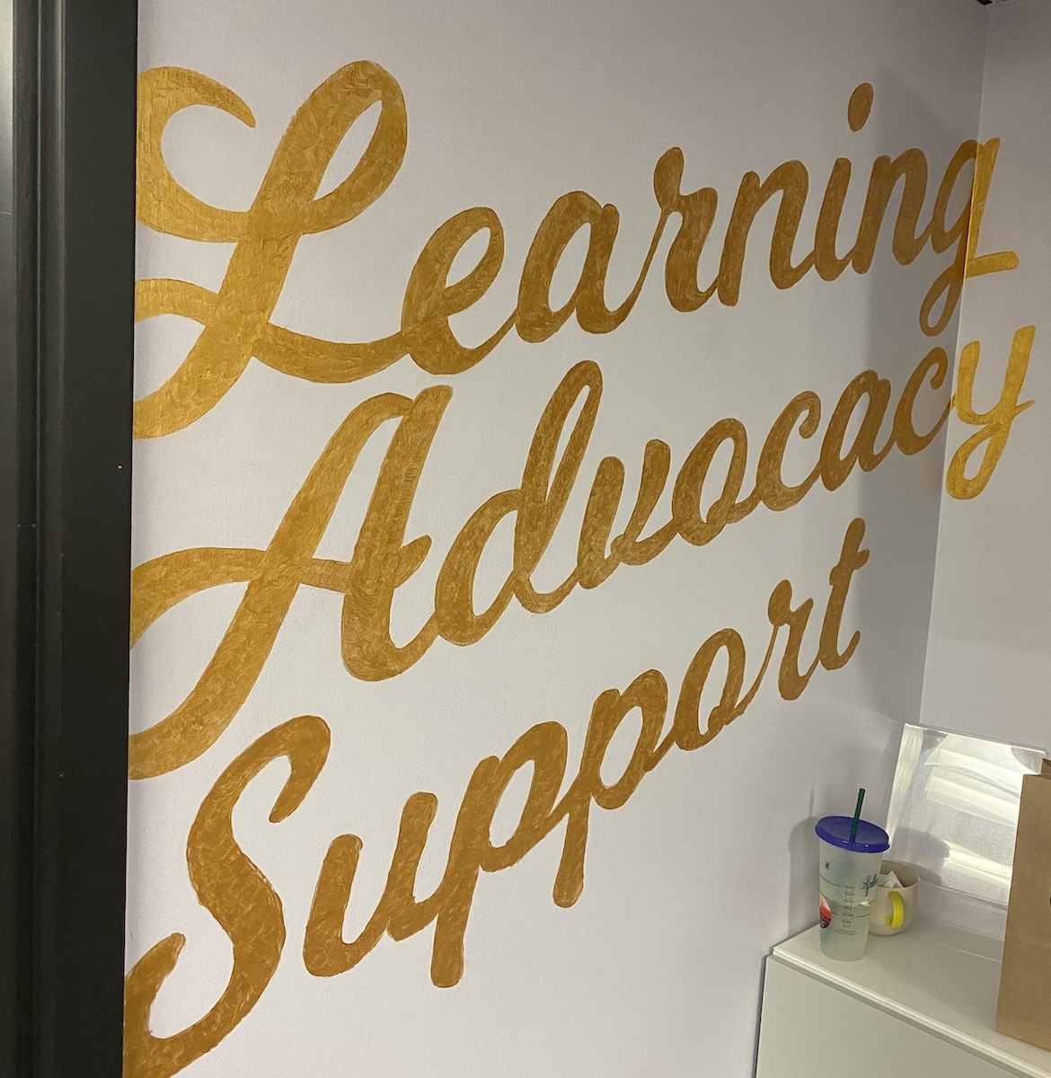 The walls of Carleton University's Womxn's Centre read learning, advocacy, and support for survivors of sexual violence.