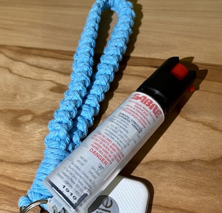 A keychain with dog spray attached to it, which can be used for self defence.