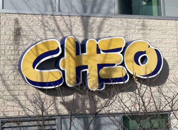 Photograph of CHEO sign on hospital building.