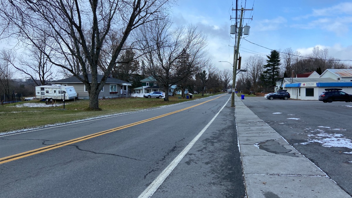 Rue Canusa is the only part of the Canada-U.S. border that runs down the middle of the street. Vermont is on the left and Quebec is on the right. [Photo: Jonathan Got © 2021]