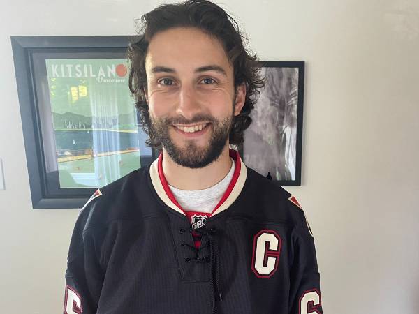 Trevor Shackles wears a black Ottawa Senators jersey.