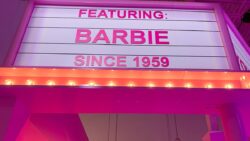 A theatre entrance sign says "Featuring: Barbie since 1959"