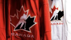 A red Hockey Canada and a white Hockey Canada jersey.