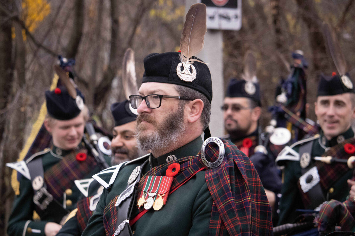 Pipes and drums is a distinct part of the unit. Before one can become a part of the pipes and drums band, they must pass the audition process, and many start playing music quite young, arriving in the unit as skilled and experienced musicians. Pictured is one of the band's members. 
