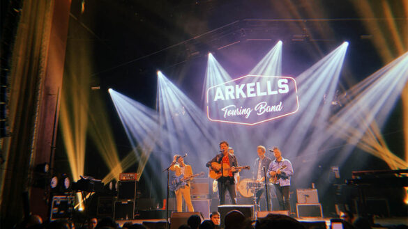 Lights shine on band the arkellls