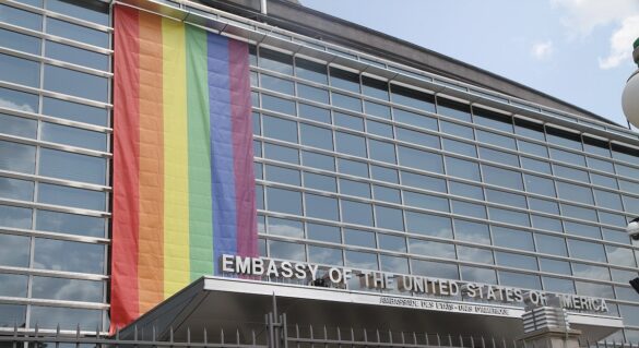 The US Embassy Canada with a large pride flag above its entrance.