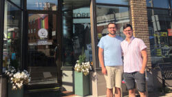 Shot of Stephen Crocker and Cole Davidson, owners of The Spaniels' Tale Bookstore, in front of their bookstore