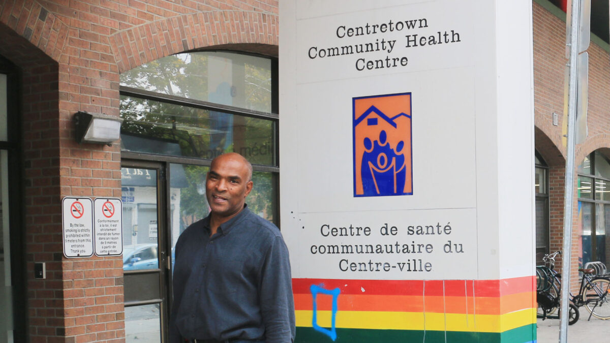 Man standing in front of Centretown Community Health Centre sign.