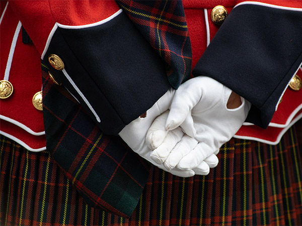 A photo of a uniformed parade member’s hands while standing at ease at the National Remembrance Day Ceremony in Ottawa.