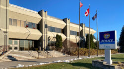 A view of the Ottawa Police Service office with the sign in front of the building