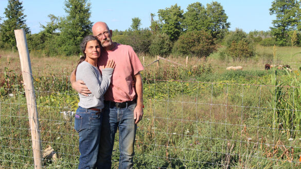 An image of Phil Mount and his partner Denis Bonin-Mount on Flat Earth Farms. Small farmers like these two are being affected by rising farmland prices.